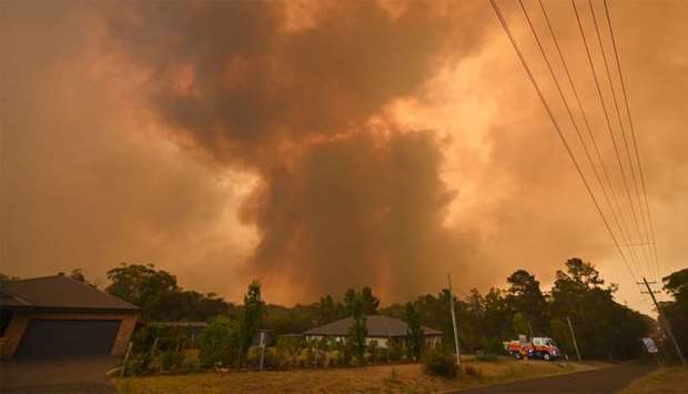 A large bushfire burns near houses in Bargo, southwest of Sydney