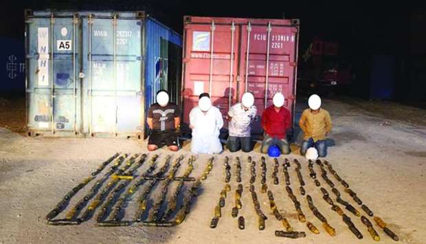 The arrested persons with the seized consignment of hashish.
