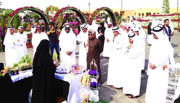 Dr Khalid bin Ibrahim al-Sulaiti, Dr Sheikh Faleh bin Nasser al-Thani, and Sulaiman al-Nuaimi, along with representatives from participating national companies at Mahaseel Festival's opening. PICTURES: Jayan Orma