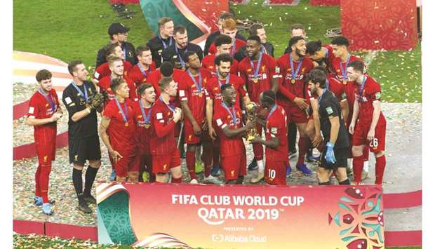 Liverpool players pose with Club World Cup trophy after beating Brazilu2019s  Flamengo in the final in Doha on Saturday.