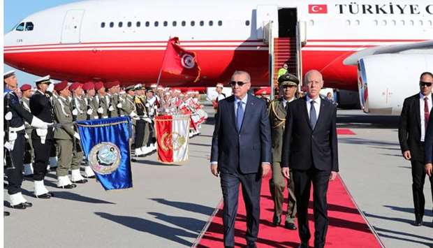 Turkey's President Tayyip Erdogan is welcomed by Tunisia's President Kais Saied at the airport in Tunis, Tunisia