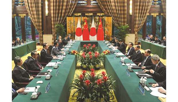 Chinau2019s Premier Li Keqiang meets with Japanu2019s Prime Minister Shinzo Abe at a bilateral meeting during the 8th trilateral leadersu2019 meeting between China, South Korea and Japan in Dujiangyan, in southwest Chinau2019s Sichuan province yesterday. Li said yesterday at a meeting with Abe that Beijing was willing to strengthen economic  co-operation with Japan in third-country markets.