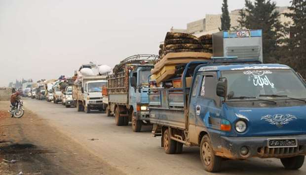 Trucks carry belongings of people fleeing from Maarat al-Numan, in northern Idlib, Syria on December 24. Reuters