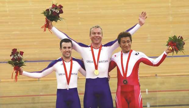 Japanu2019s Kiyofumi Nagai stands alongside Britainu2019s Ross Edgar (left) and Chris Hoy (centre) after the menu2019s keirin final at the 2008 Olympics. (AFP)