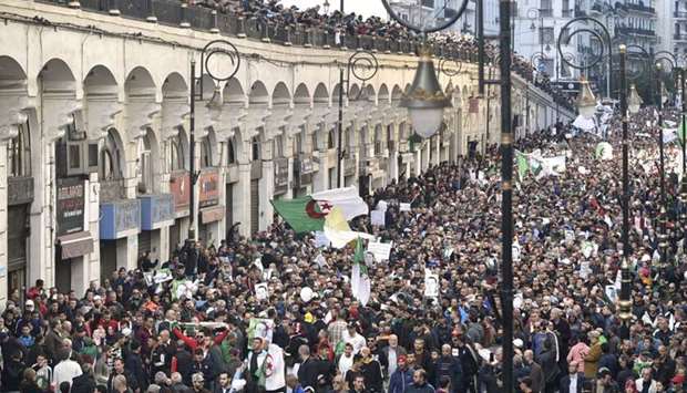 Algerian protesters take part in an anti-government demonstration in the capital Algiers yesterday.