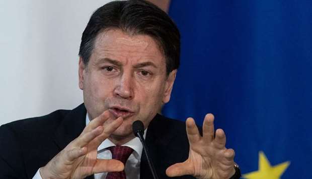 Italy's Prime Minister Giuseppe Conte gestures as he speaks during the end-of-year press conference