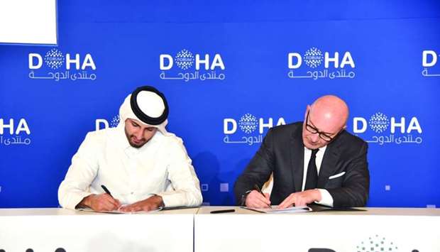 Sheikh Ali Alwaleed al-Thani (left) signing the agreement with Sahnek in Doha recently.