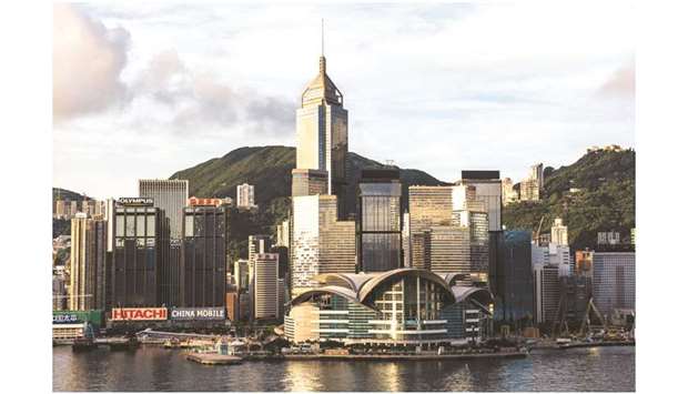 Commercial and residential buildings standing on Hong Kong island are seen from the Tsim Sha Tsui district. Hong Kongu2019s economy is set to contract in the fourth  quarter as the city reels from six months of violent social unrest, the financial chief said yesterday.