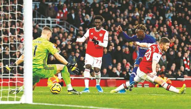 Chelseau2019s Tammy Abraham (second from right) scores their second goal during the English Premier League match against Arsenal at the Emirates Stadium in London, United Kingdom, yesterday. (AFP)