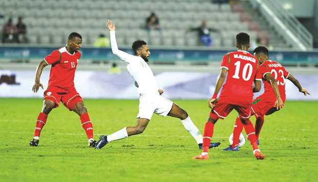 Saudi Arabiau2019s Feras Albrikan (second from left) in action during the 24th Arabian Gulf Cup match against Oman at Abdullah Bin Khalifa Stadium yesterday. PICTURE: Shemeer Rasheed