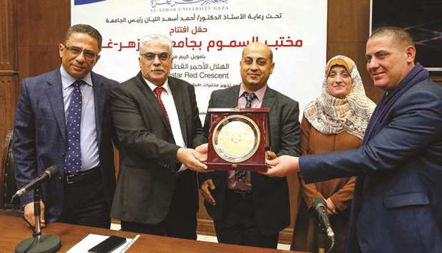 Officials of QRCS and Al-Azhar University Gaza at the event.