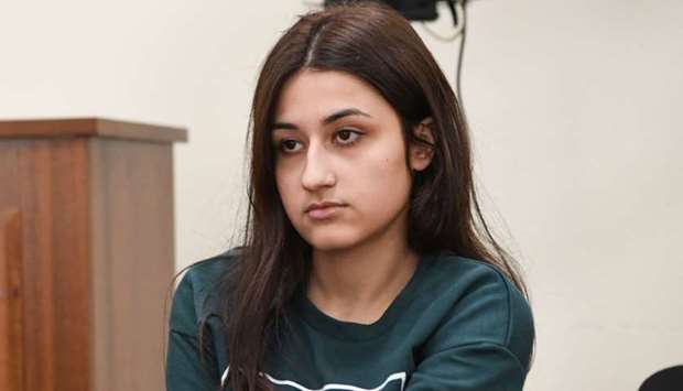 Krestina Khachaturyan, one of three teenage sisters accused of murdering their father, attends a hearing at a court in Moscow.  File photo taken on June 26, 2019