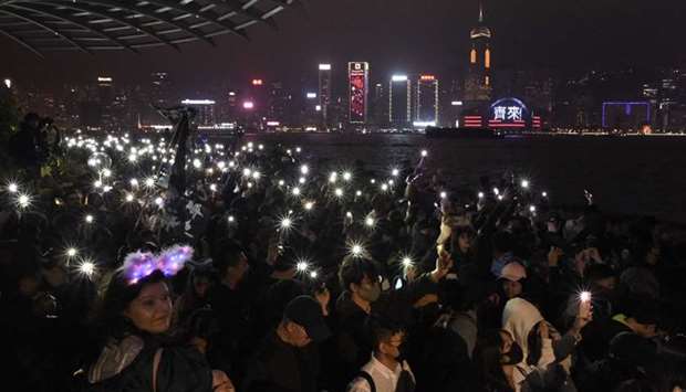 Pro-democracy protesters and people gather at the promenade of Tsim Sha Tsui district as they they take part in a rally and to celebrate the new yearu2019s eve, in Hong Kong