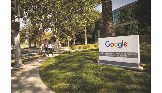 Pedestrians walk past signage at Google headquarters in Mountain View, California. Software copyright law, fair use law, thresholds for overturning jury verdicts, and the rightful owner of $8.8bn are all in play as Google fights a pair of rulings that it infringed Oracleu2019s Java software to help create its Android platform.