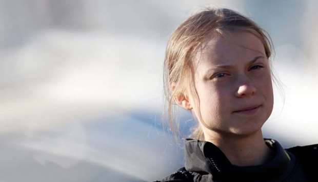 Climate change activist Greta Thunberg looks on upon her arrival at Santo Amaro port in Lisbon, Portugal