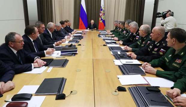 Russian President Vladimir Putin chairs a meeting with top officials of the Russian Defence Ministry in Sochi