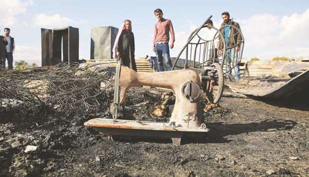 This picture taken yesterday shows the remains of a home where several Pakistani farmers died in a fire, in the town of Shuna in Jordan, some 50km southwest of Amman.