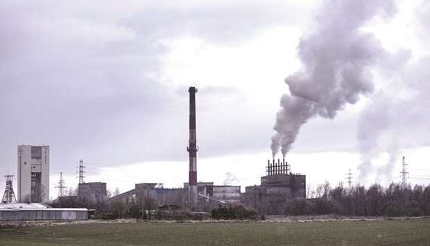 Vapour escapes from chimneys at the coal processing facility in the  Piniowek coal mine in Pawlowice, Poland. To ensure that coal-reliant Poland doesnu2019t veto the climate goals, EU leaders will pledge an u201cenabling  frameworku201d that will include financial support, according to a document dated December 2.