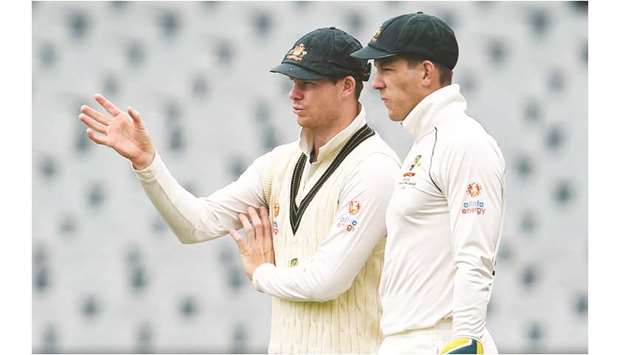 Australiau2019s Steve Smith (left) speaks with captain Tim Paine on the third day of the second Test against Pakistan in Adelaide on Monday. (AFP)