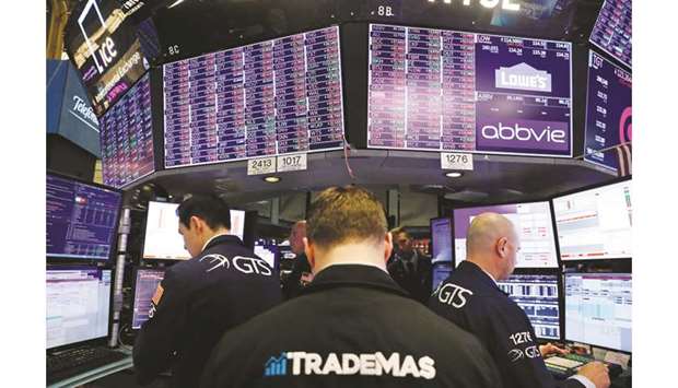 Traders work on the floor of the New York Stock Exchange yesterday. Global equities came within a whisker of their all-time high last month, propelled in part by swelling  optimism that at least an interim US-China trade deal was in the offing.