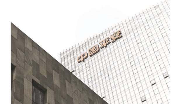 The Pingu00a0Anu00a0Insurance Group Company logo is displayed atop the Ping An International Financial Centre in Beijing. Ping Anu2019s OneConnect Financial Technology launched a US initial public offering of up to $504mn yesterday, reducing both its target offering size and valuation.