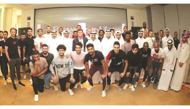 Qatar Stars League CEO Hani Taleb Ballan, Executive Director of Competitions and Football Development Ahmed Khellil Abbassi, Player Affairs Director Mohamed Ahmed al-Abdullah and Josoor Instituteu2019s Director of Diploma Programmes Prof Dino Ruta pose with players, coaches and administrators of QNB Stars League clubs.
