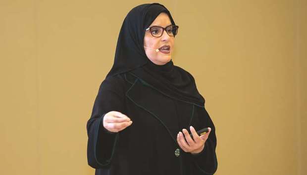 Amal bint Abdullatif al-Mannai speaking at the workshop.