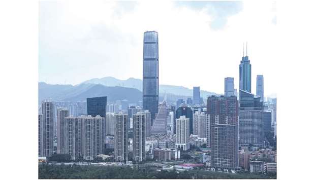 Residential and commercial buildings are seen in Lo Wu district of Hong Kong. Business activity in Hong Kong contracted at the fastest pace in 21 years in November, dragged down by the protests and softening global demand, an IHS Markit survey showed yesterday.