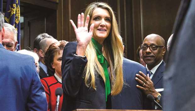 Newly appointed senator Kelly Loeffler waves toward supporters following a press conference in the governoru2019s office at the Georgia State Capitol Building yesterday.
