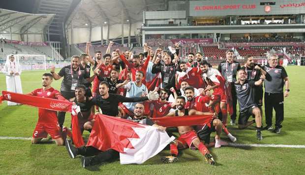 Bahrain players celebrate their win in the Gulf Cup semi-final against Iraq at Abdullah Bin Khalifa Stadium yesterday. PICTURES: Anas Khalid