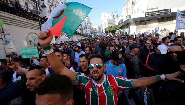 Demonstrators take part in a protest to demand for the presidential election scheduled for next week to be cancelled, in Algiers, Algeria