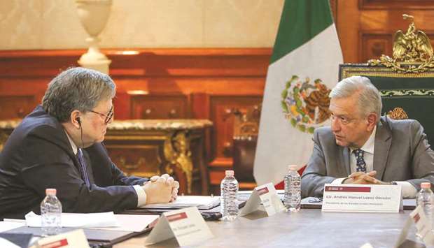 This handout photo released by the Mexican presidency shows Obrador with US Attorney-General Barr during their meeting at the Palacio Nacional.