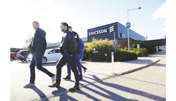 Workers walk outside the Ericsson factory in Boras, Sweden. A unit of Ericsson pleaded guilty to foreign bribery and the parent company agreed to pay more than $1bn to resolve a long-running US corruption investigation involving payoffs in Asia and the Middle East.