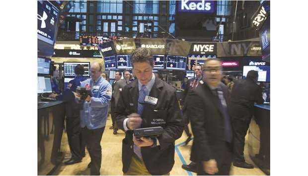 Traders work on the floor of the New York Stock Exchange (file). Wall Street could see more volatility ahead of December 15, when the next tranche of US tariffs on Chinese imports is set to take effect.