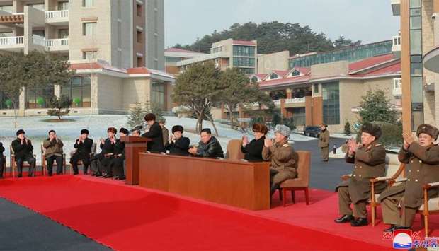 North Korean leader Kim Jong Un (C) attending a ceremony for the completion of the Yangdok County Hot Spring Cultural Recreation Center in South Pyongan Province