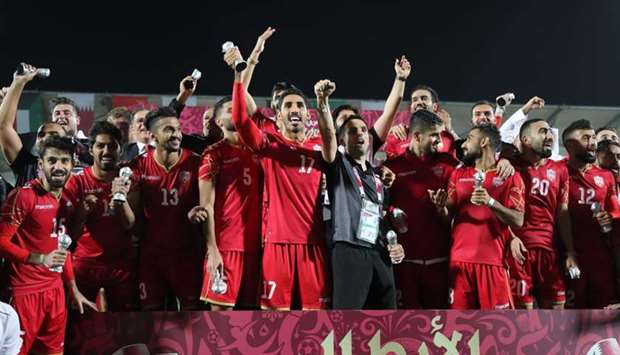 Bahrain's players celebrate after winning the 24th Arabian Gulf Cup Final football match between Bahrain and Saudi Arabia at the Khalifa International Stadium in Doha
