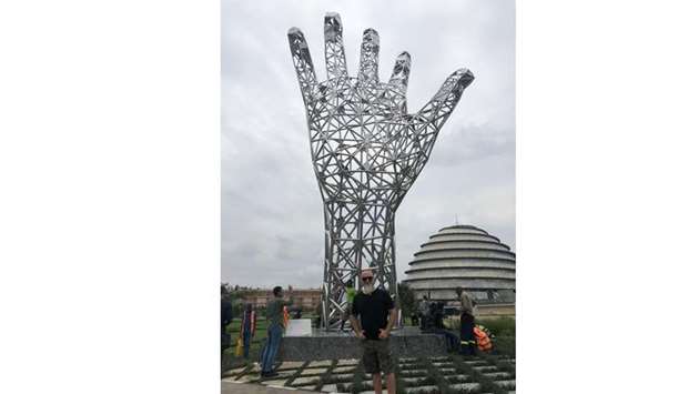 The newly designed artwork for the Sheikh Tamim Bin Hamad Al Thani International Anti-Corruption Excellence Award has been installed in Kigali, Rwanda, where the fourth edition of the award is being held Monday. Doha-based Iraqi contemporary artist and sculptor Ahmed Albahrani is seen in front of his creation.