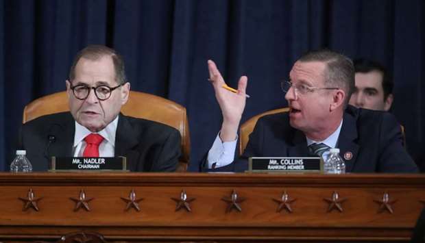 Republican House Judiciary Committee ranking member Doug Collins (R-GA) and commitee Chairman Rep. Jerrold Nadler (D-NY) debate the rules during a House Judiciary Committee hearing to receive counsel presentations of evidence on the impeachment inquiry into US President Donald Trump on Capitol Hill in Washington