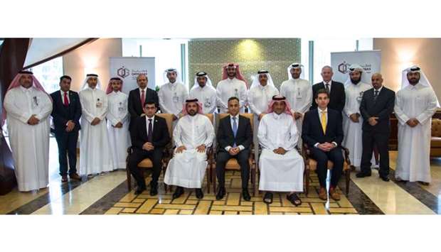 Sheikh Khalid, Sharma and al-Hemaidi with senior Qatargas executives at the certificate handover ceremony.