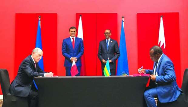 His Highness the Amir Sheikh Tamim bin Hamad Al-Thani and the President of the Republic of Rwanda Paul Kagame witness signing of an agreement