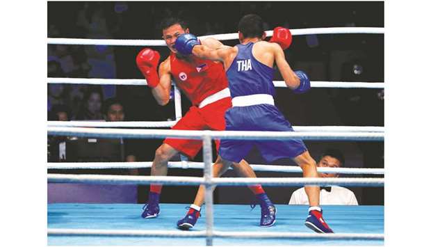 Philippinesu2019 Charly Suarez (left) in action against Thailandu2019s Pidnuch Khunatip during the menu2019s Lightweight (60kg) final in the Southeast Asian Games at Picc Forum in Pasay, Philippines, yesterday. (Reuters)