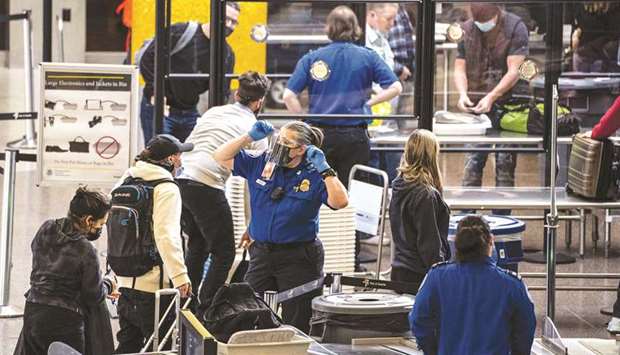 Travellers pass through security screening at Seattle-Tacoma International Airport in SeaTac, Washington.