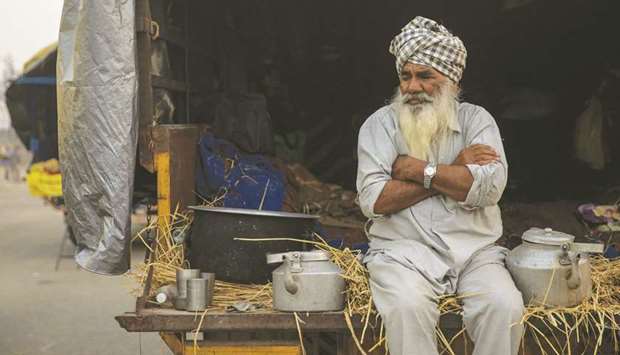 A farmer sits in a tractor trolley during a protest against the newly-passed farm bills at Singhu border near Delhi yesterday.