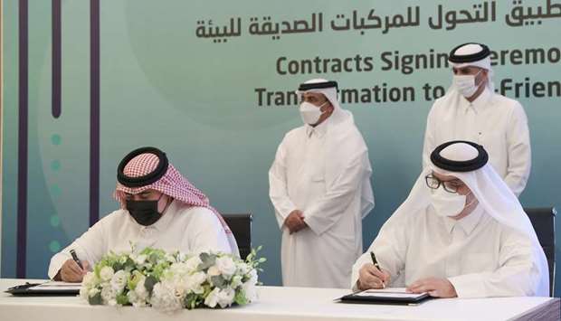 HE the Prime Minister and Interior Minister Sheikh Khalid bin Khalifa bin Abdulaziz al-Thani and HE the Minister of Transport and Communications Jassim Seif Ahmed al-Sulaiti witness the signing of an agreement.