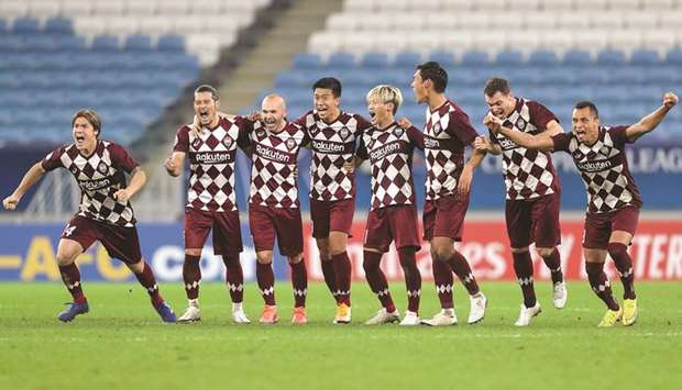 Vissel Kobe players celebrate after winning the AFC Champions League quarter-final against Suwon Samsung Bluewings in a penalty shootout at Al Janoub Stadium yesterday. (AFP)