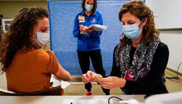 Healthcare workers take part in a rehearsal for the administration of the Pfizer coronavirus disease vaccine at Indiana University Health in Indianapolis, Indiana, US