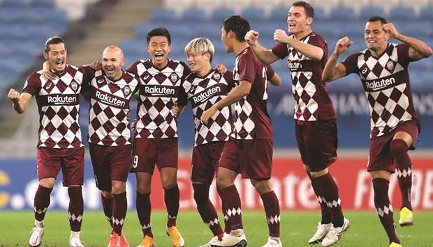 Vissel Kobe players celebrate after winning the AFC Champions League quarter-final against Suwon Samsung Bluewings in a penalty shootout at Al Janoub Stadium on Thursday. (AFP)