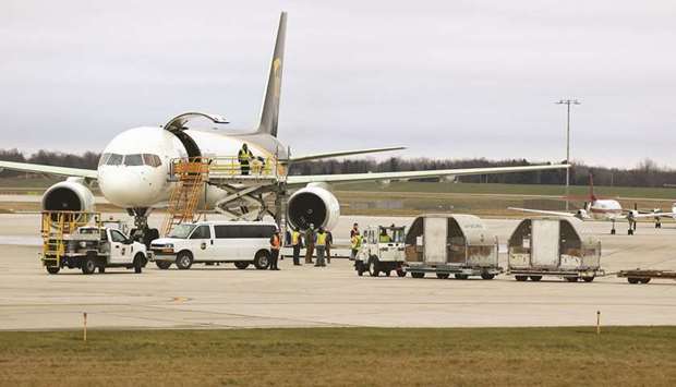 Shipments of the Pfizer-BioNTech Covid-19 vaccine are loaded into a UPS plane in Lansing, Michigan, yesterday.