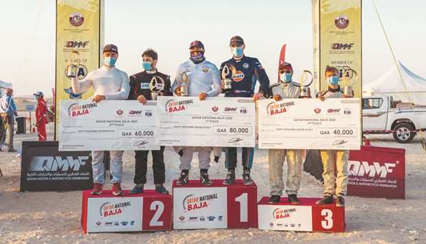 Overall podium winners pose after the fifth and final round of the Qatar National Baja at Sealine on Saturday.