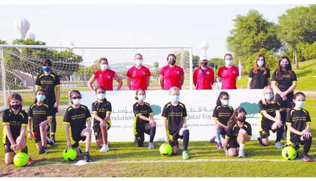 The Washington Spirit players with QF girlsu2019 football team at an event in the Oxygen Park.